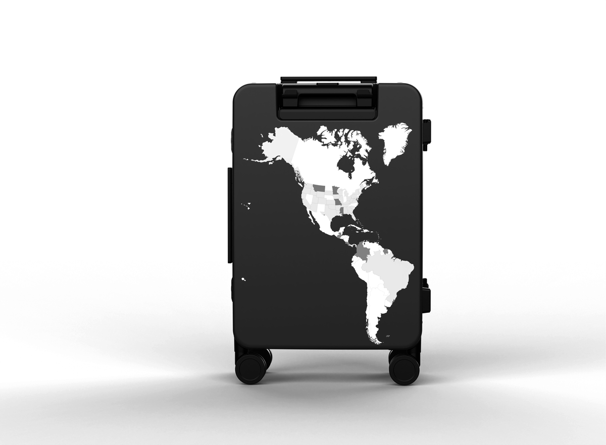 Black suitcase with a world map design on a white background