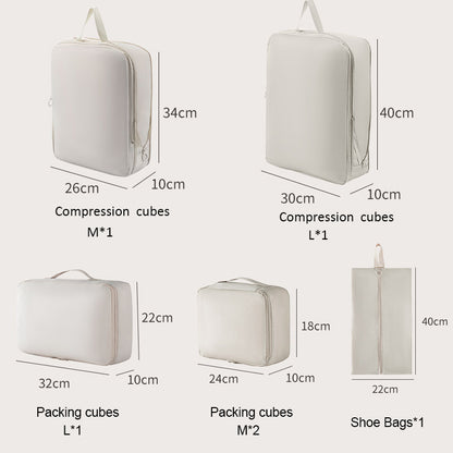 Set of compression cubes and packing cubes with dimensions labeled on a white background